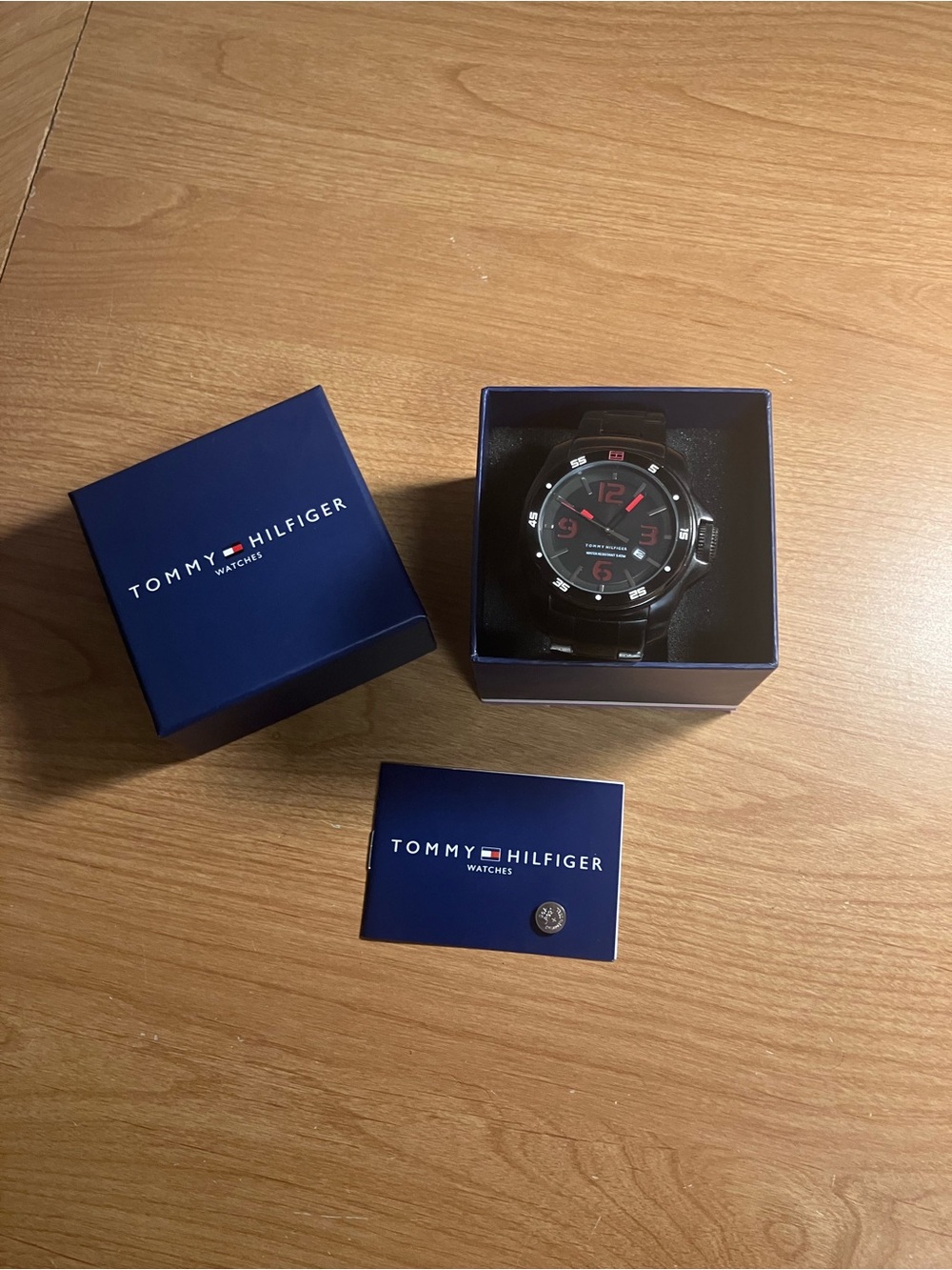 Tommy Hilfiger Black Watch with Red Dial Accents